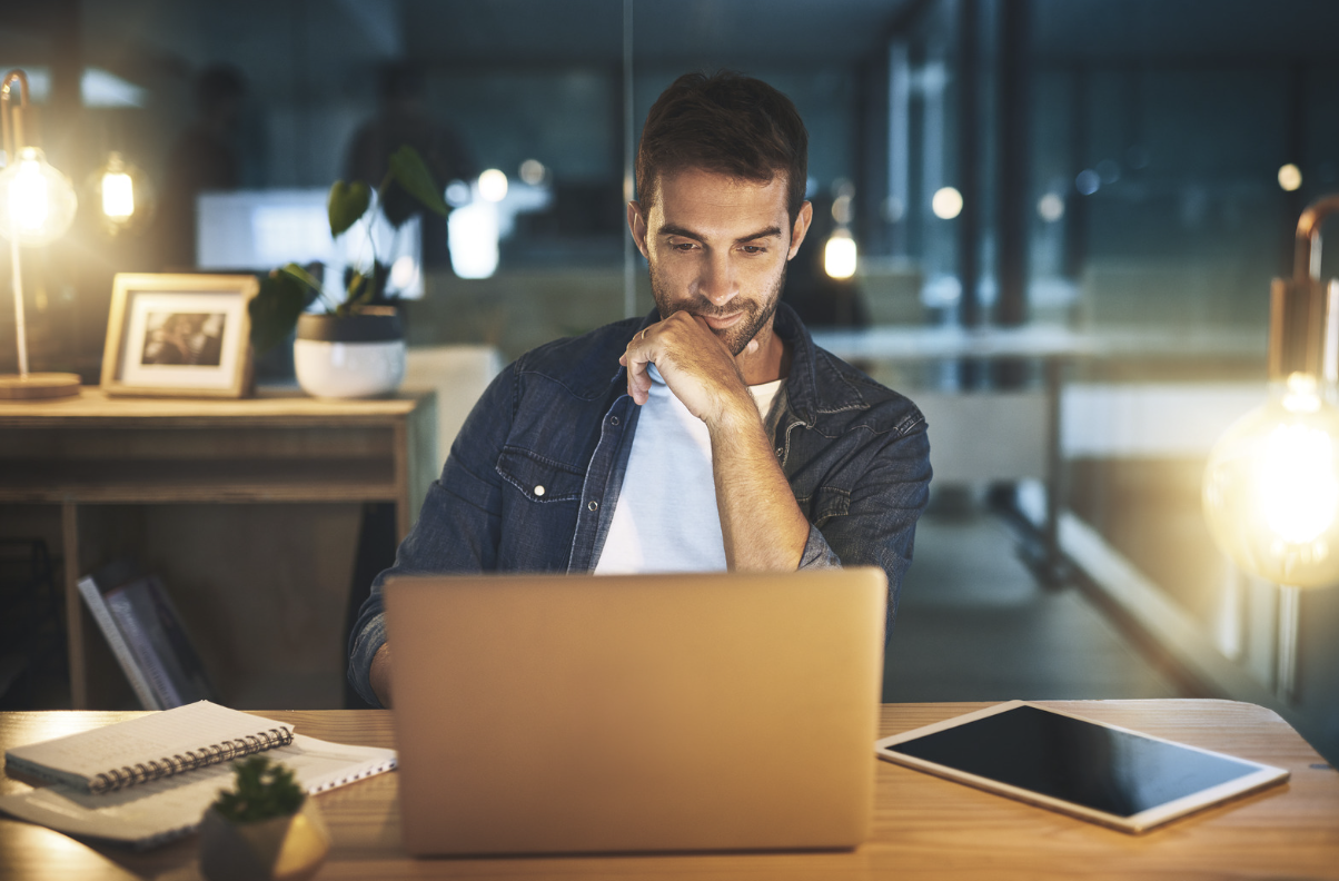 Picture shows person working on a laptop, very focused, demonstrating the benefits of nootropics on well being